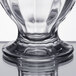 A close up of a Libbey clear glass sundae dish with a circular design.