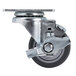 A 3" Swivel Plate Caster with a metal wheel and round metal plate.