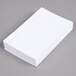 A stack of white Oxford ruled index cards.