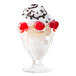 A Libbey tulip sundae glass filled with a sundae, whipped cream, and cherries.