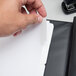 A person using Oxford white file dividers to organize a piece of paper.