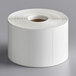 A Cardinal Detecto white thermal label roll with white labels.