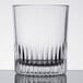 A close-up of a Libbey clear glass with a ribbed rim.