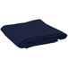A folded navy blue Intedge round table cover.