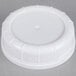A white plastic Libbey milk bottle lid with a circular design.