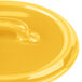 A close-up of a yellow Bon Chef porcelain oval lid.