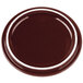 A burnt umber porcelain lid with a white rim.