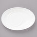 A white Bon Chef oval porcelain saucer on a gray surface.