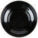 A black melamine salsa dish with a circle in the middle.