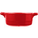 A red porcelain Bon Chef oval cocotte with handles.