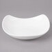 A white Bon Chef salad bowl with a curved design.