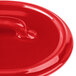 A close-up of a red Bon Chef porcelain oval cocotte lid with a handle.