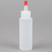 A white plastic Tablecraft squeeze bottle with a red cap.