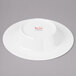 A white wide rim bone china bowl.