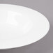 A white Bon Chef bone china soup bowl with a wide rim.