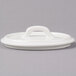 A white porcelain lid with a handle.