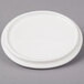 A white Bon Chef oval cocotte lid on a white plate.