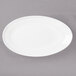 A white Bon Chef porcelain oval plate with a white rim.