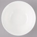 A white Bon Chef porcelain bowl with circles on a white background.