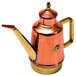 A copper and brass oil cruet with a gold handle.