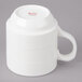 A white Bon Chef porcelain mug with stacked lines on the side and a handle.