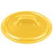 A yellow Bon Chef porcelain lid with a handle.