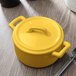 The yellow lid on a Bon Chef yellow porcelain cocotte.