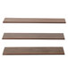 A set of wooden Elevation walnut shelves with three assorted sizes.
