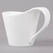 A white Bon Chef bone china cup with a curved handle.