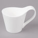 A white Bon Chef bone china cup with a handle.