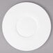 A white Bon Chef bone china plate with a wide white rim.