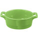 A green Bon Chef porcelain pot with handles.