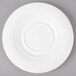 A white Bon Chef porcelain saucer with a circular pattern.