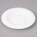 A white Bon Chef porcelain saucer with a circular pattern.