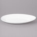 A white Bon Chef porcelain oval plate with a curved edge.