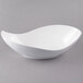 A 10 Strawberry Street Whittier white porcelain canoe bowl on a gray surface.