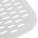 A white plastic tray with holes in it sitting on a metal grate.