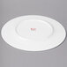 A white Bon Chef bone china charger plate with a wide round rim.