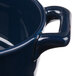 A close up of a Bon Chef cobalt blue porcelain oval cocotte with handles.
