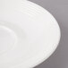 A close-up of a white Bon Chef porcelain saucer with a rim.