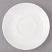 A white Bon Chef porcelain saucer with circles on the rim.
