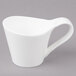 A Bon Chef white bone china espresso cup with a handle.