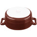 A brown and white porcelain oval cocotte with handles.