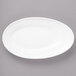 A white Bon Chef porcelain oval plate with a curved edge.