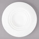 A white Bon Chef porcelain bowl with a circular pattern on the rim.