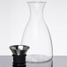 A GET Silhouette glass decanter with a dripless stainless steel lid.