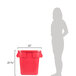 A woman standing next to a red Rubbermaid BRUTE trash can with a snap-lock lid.