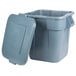 A Rubbermaid gray plastic BRUTE trash can with the lid open.