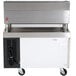 A Cooking Performance Group gas charbroiler on top of a stainless steel chef base with drawers.