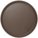 A round brown Cambro Camtread non-skid serving tray.